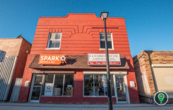 a sign above a store in a brick building